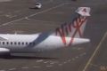 The Virgin Australia ATR72 turboprop aircraft taxiing onto the bay at Sydney Airport on February 20, 2014.