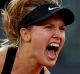 Eugenie Bouchard of Canada celebrates match point in her match against Maria Sharapova of Russia on day three of the ...