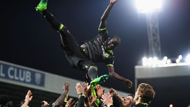 N'Golo Kante of Chelsea is chucked in the air while celebrating winning the title.