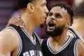 Patty Mills talks with guard Danny Green as Spurs ousted the Rockets from the NBA conference semi-finals.