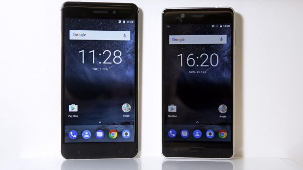 The new Nokia 6 smartphone in matt black, left, and the new Nokia 5 smartphone in silver.