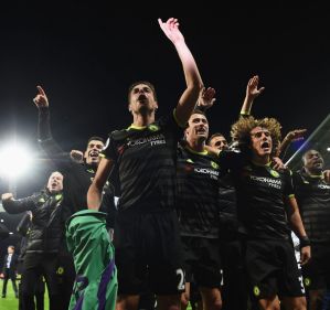 Champions: The Chelsea team celebrate winning the league after beating West Brom.