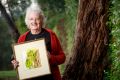 Jane Brummitt with an original May Gibbs painting. 