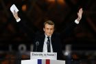 French President-elect Emmanuel Macron gestures during a victory celebration outside the Louvre museum in Paris, France,