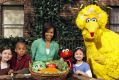 Michelle Obama with Big Bird and Elmo getting out her healthy-eating message in 2009.