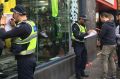 Police speaking to the public outside Melbourne Central after the reported stabbing.