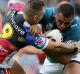 NEWCASTLE, AUSTRALIA - MAY 14:  Junior Paulo of the Raiders is tackled by Danny Levi of the Knights during the round 10 ...