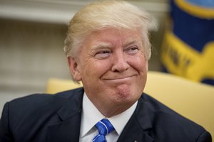 President Donald Trump smiles while meeting with Abu Dhabi's Crown Prince Sheikh Mohammed bin Zayed Al Nahyan, Monday, May 15, 2017, in the Oval Office of the White House in Washington.