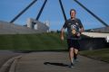 Opposition Leader Bill Shorten departs Parliament House for a run around Lake Burley Griffin, in Canberra on Thursday 11 ...