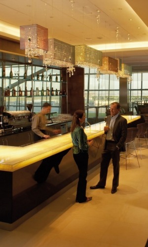 Oneworld will get you access into first classes lounges, like British Airways' Concorde Room.