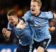 Ecstatic: Sydney FC players celebrate winning the grand final.