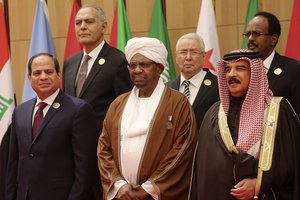 Omar al-Bashir, center, president of Sudan, stands between Egyptian president Abdel Fattah el-Sisi, left, and Bahrain's King Hamad bin Isa Al Khalifa at the annual Arab League summit on Wednesday, March 29, 2017 held this year on the Dead Sea in Jordan.