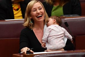 Greens co-deputy leader Larissa Waters soothes baby Alia Joy after breastfeeding her in the Senate.