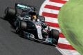 Thirsty work: Lewis Hamilton earns another Formula One in spectacular fashion, losing almost two kilograms of fluids in ...