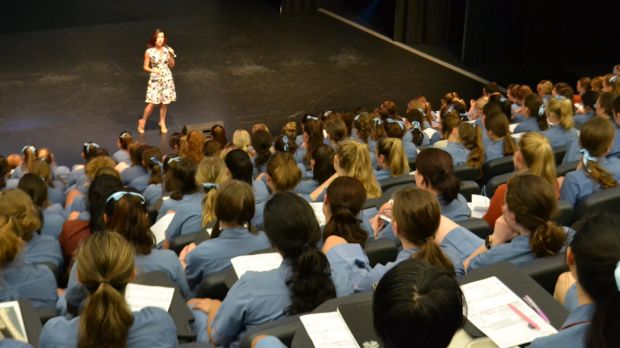 Nicole Pedersen-McKinnon presenting to high school students.