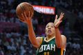 Utah Jazz guard Dante Exum (left) shoots as Los Angeles Clippers guard Chris Paul defends.