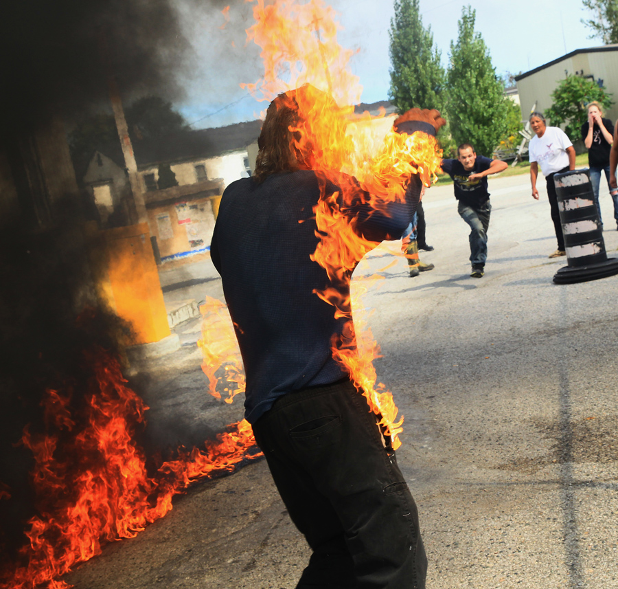 Pierre George, the brother of killed protester Dudley George, is engulfed in flames after attempting to pour gasoline on a fire during a protest against a community march intended to "walk home" to the gates of the former Camp Ipperwash on Sunday, Sept. 20, 2015, in London, Ontario. The land is being returned to the Kettle and Stony Point First Nation after being expropriated by the Federal government during the Second World War. THE CANADIAN PRESS/Dave Chidley