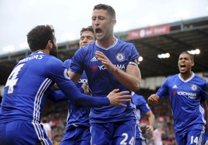 Chelsea’s Gary Cahill celebrates with Cesc Fabregas after scoring during the English Premier League soccer match between Stoke City and Chelsea at the Britannia Stadium, Stoke on Trent, England, Saturday, March 18, 2017.