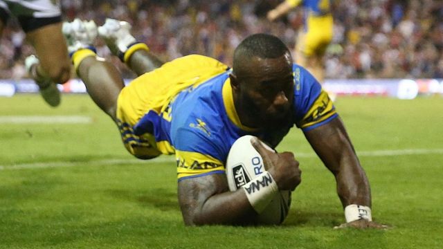 Try and mighty: Semi Radradra crosses for one of his four tries against the Dragons.