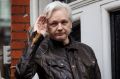 LONDON, ENGLAND - MAY 19: Julian Assange gestures as he speaks to the media from the balcony of the Embassy Of Ecuador ...