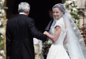 Pippa Middleton arrives with her father Michael Middleton for her wedding to James Matthews at St Mark's Church in Englefield, England Saturday, May 20, 2017.