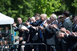 President Donald Trump and Vice President Mike Pence and guests on the dais included the Attorney General Jeff Sessions and the Director the U.S. Marshals Service David Harlow during the ceremony family of fallen officers placed carnations for the fallen forming a star and received a medal for the officer’s service