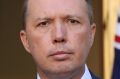 Australia's Immigration Minister Peter Dutton says Australia can't afford to be taken for a ride by people who refuse to ...