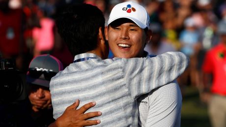 South Korea's Si Woo Kim celebrates on the 18th green after winning The Players Championship.