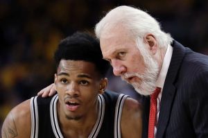 Spurs coach Gregg Popovich with guard Dejounte Murray during game 2 of the NBA western conference finals against Golden ...