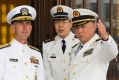 US Chief of Naval Operations Admiral John Richardson, left, listens to Commander of the Chinese Navy Admiral Wu Shengli, ...