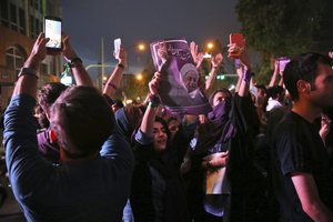 Supporters of the Iranian President Hassan Rouhani celebrate after he won the Friday's presidential election, in Tehran, Iran, Saturday, May 20, 2017.