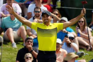 Good drop: Jason Day celebrates after sinking a 60-foot putt on his way to a seven-under round of 63.