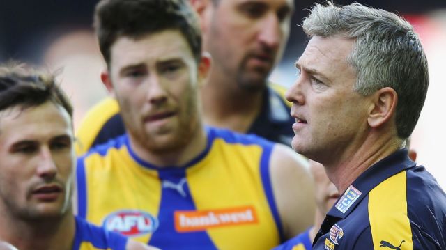 Wasted opportunity: Eagles head coach Adam Simpson adresses his players.