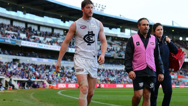 Sam Rowe walks the boundary line at Domain Stadium after seriously injuring his knee