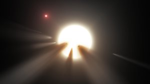 File - Using data from NASA's Kepler and Spitzer Space Telescopes, this artist's concept shows a star behind a shattered comet. Observations of the star KIC 8462852 by NASA's Kepler and Spitzer space telescopes suggest that its unusual light signals are likely from dusty comet fragments