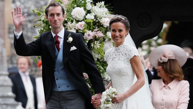 Pippa Middleton and James Matthews smile for the cameras after their wedding at St Mark's Church in Englefield.