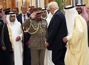 Saudi King Salman and President Donald Trump are saluted as they arrive to the Arab Islamic American Summit, at the King Abdulaziz Conference Center, Sunday, May 21, 2017, in Riyadh.