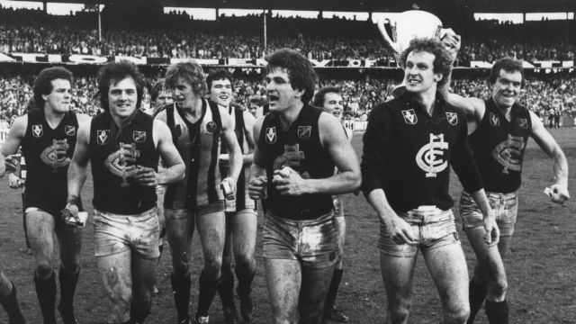 Jubilant Carlton players run a lap of honour after winning the 1979 grand final against Collingwood.