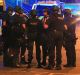 Armed police at Manchester Arena after an explosion at the venue during an Ariana Grande gig.