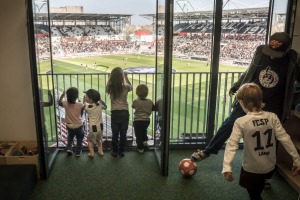 A kindergarten class watches preparations for a match from a classroom inside the FC St. Pauli soccer team's stadium in ...