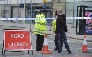 Police block a road near to the Manchester Arena in central Manchester, England Tuesday, May 23, 2017.