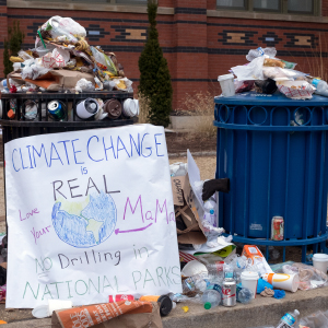 A placard warning against the dangers of climate change used in the March on Washington stands by an overflowing garbage can January 21st 2017, up to 500,000 marchers had protested earlier in DC and estimates of five million nationwide campaigned for legislation and policies regarding human rights, women's rights, immigration reform, healthcare reform, the natural environment, LGBTQ rights, racial equality and freedom of religion in response to the newly elected presidency of Donald Trump. (Epics/Getty Images)