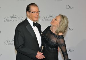 U.S. actor Roger Moore, left, and his wife Cristina Tholstrup pose on the red carpet as they arrive at the Monaco palace to attend the Princess Grace Foundation gala in Monaco, Saturday, Sept.5, 2015.