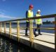 Andrew Barr and Mick Gentleman check out the first part of the West Basin boardwalk on Tuesday.