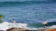 Swimmers take advantage of warmer weather at Cronulla.