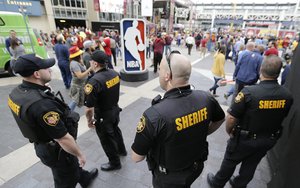 Sheriff's Deputies keep watch on fans as they enter Quicken Loans Arena for Game 4 of the NBA basketball Eastern Conference finals between the Boston Celtics and the Cleveland Cavaliers, Tuesday, May 23, 2017, in Cleveland.