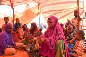 File - Internally displaced persons (IDPs) fleeing drought seek assistance at Al Adala temporary camp, Mogadishu, 26 March 2017.