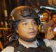 Police officers clear the scene after an explosion near a bus stop in the Kampung Melayu area of Jakarta.