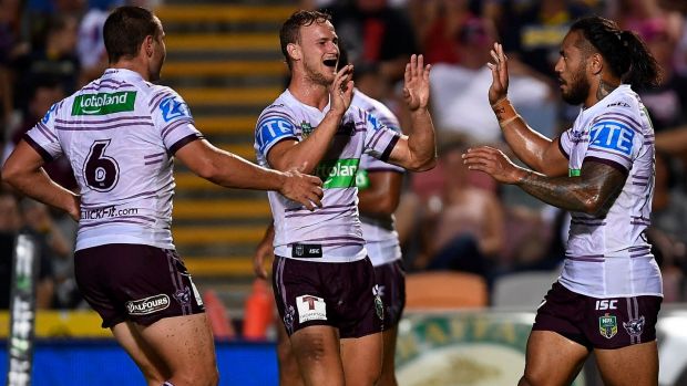 Turning point Jorge Taufua (r) of the Sea Eagles celebrates after scoring a try.