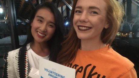 Orange Sky Laundry Canberra service manager Noreen Vu and volunteer Rebecca Butchart with the volunteering award won by ...